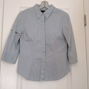 Button down cotton shirt with embroidery in baby blue color.Size 7/8. Runs small